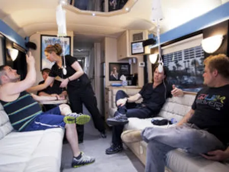 Inside the Hangover Heaven bus: patients recline with IV drips while a staff member attends