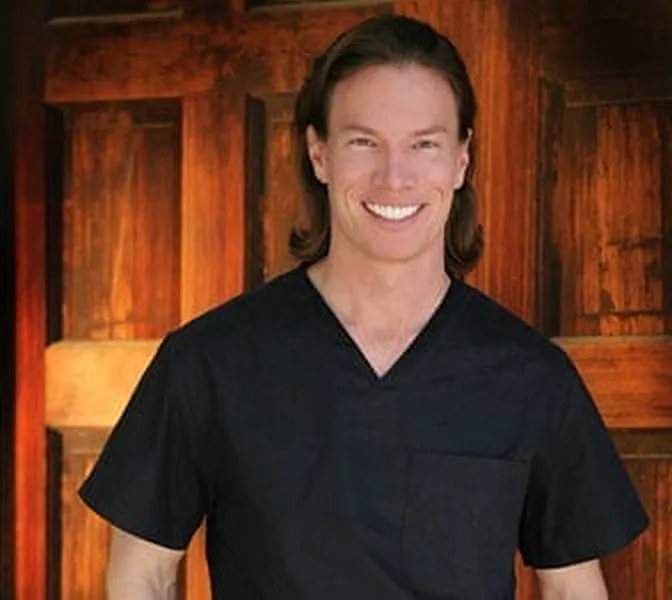 Dr. Jason Burke, founder and president of Hangover Heaven, in black scrubs