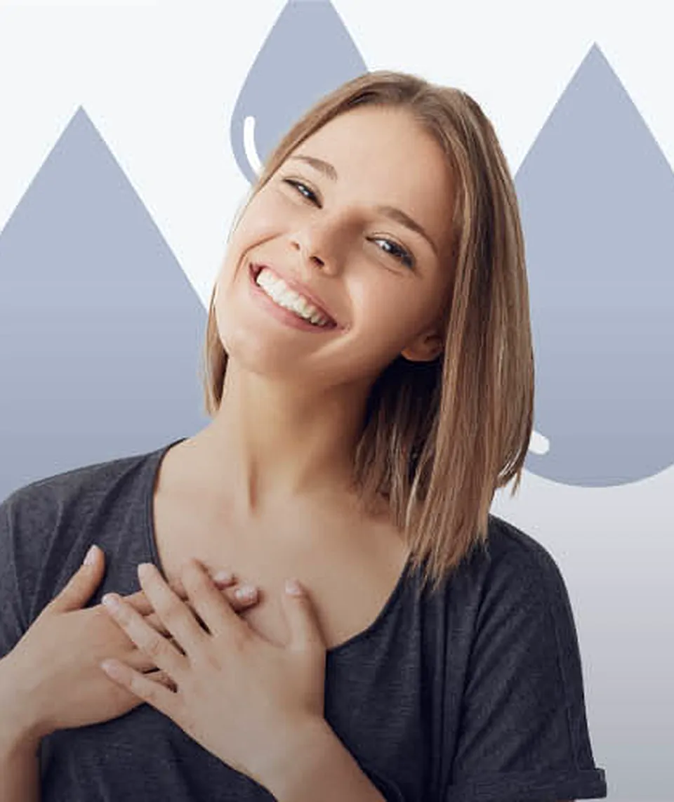 A smiling woman with shoulder-length hair holds both hands to her chest, in front of the brand's blue droplet shapes
